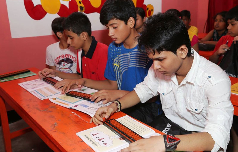 Abacusmaster Guwahati students doing abacus calculations