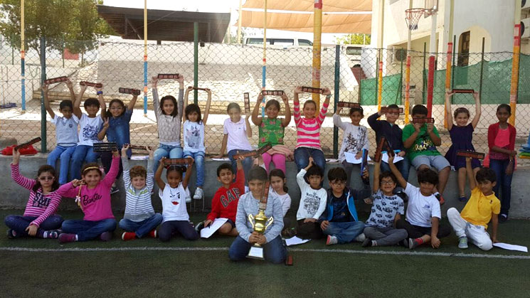 Picture of students posing with their abacus kits for a picture at AbacusMaster, Muscat branch