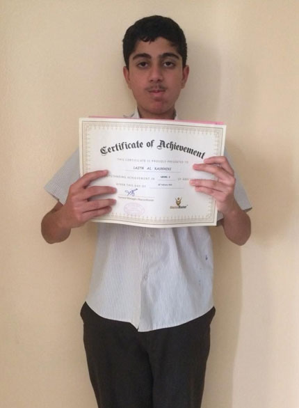 Picture of a student posing with her certificate for a picture at AbacusMaster, Muscat branch