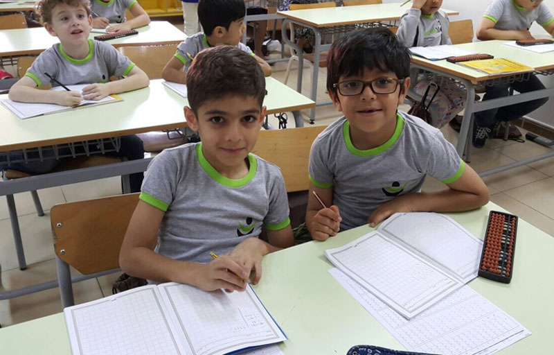 Picture of young boys working out abacus problems at AbacusMaster, Muscat branch