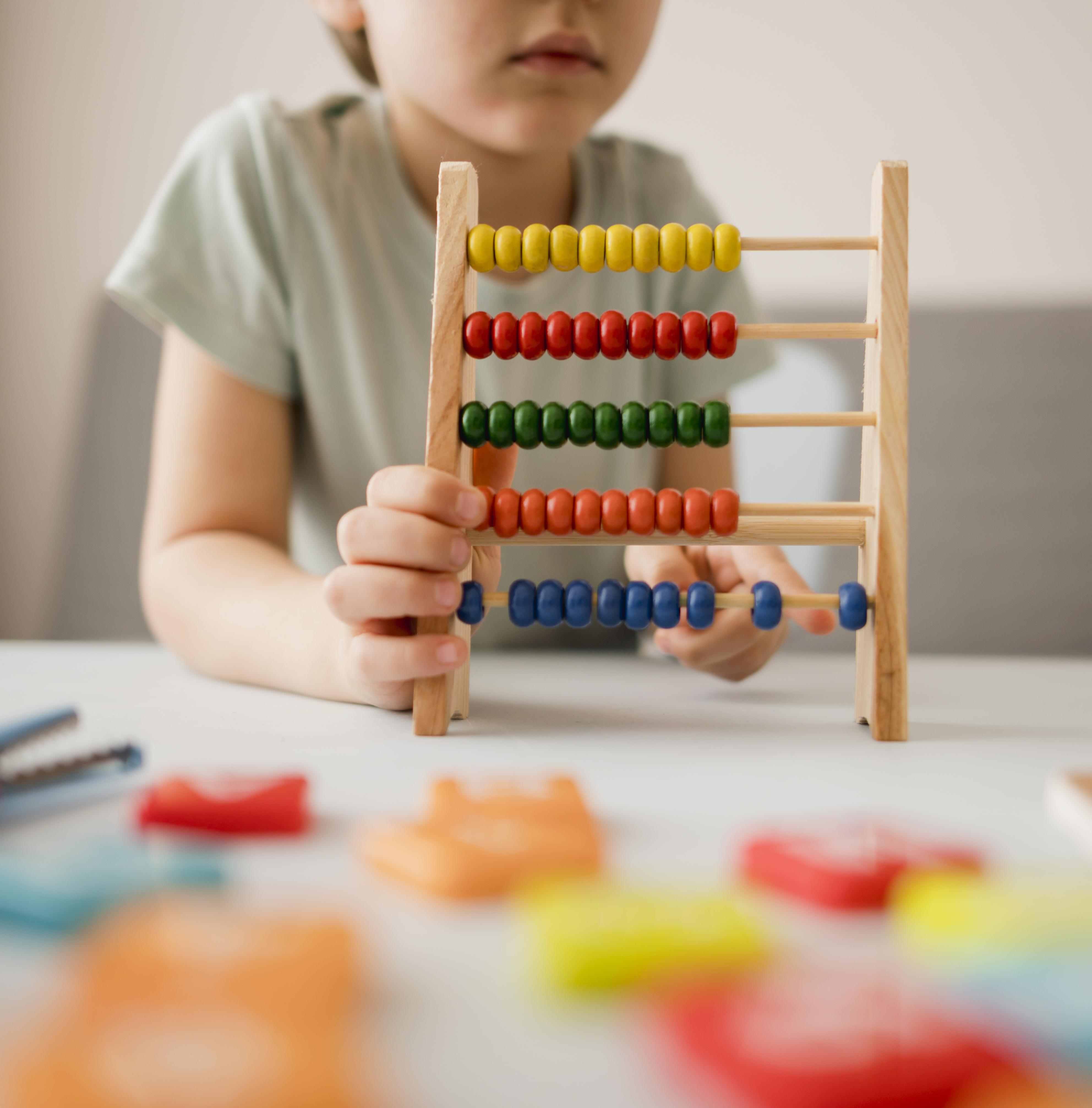 child learning math with abacus 