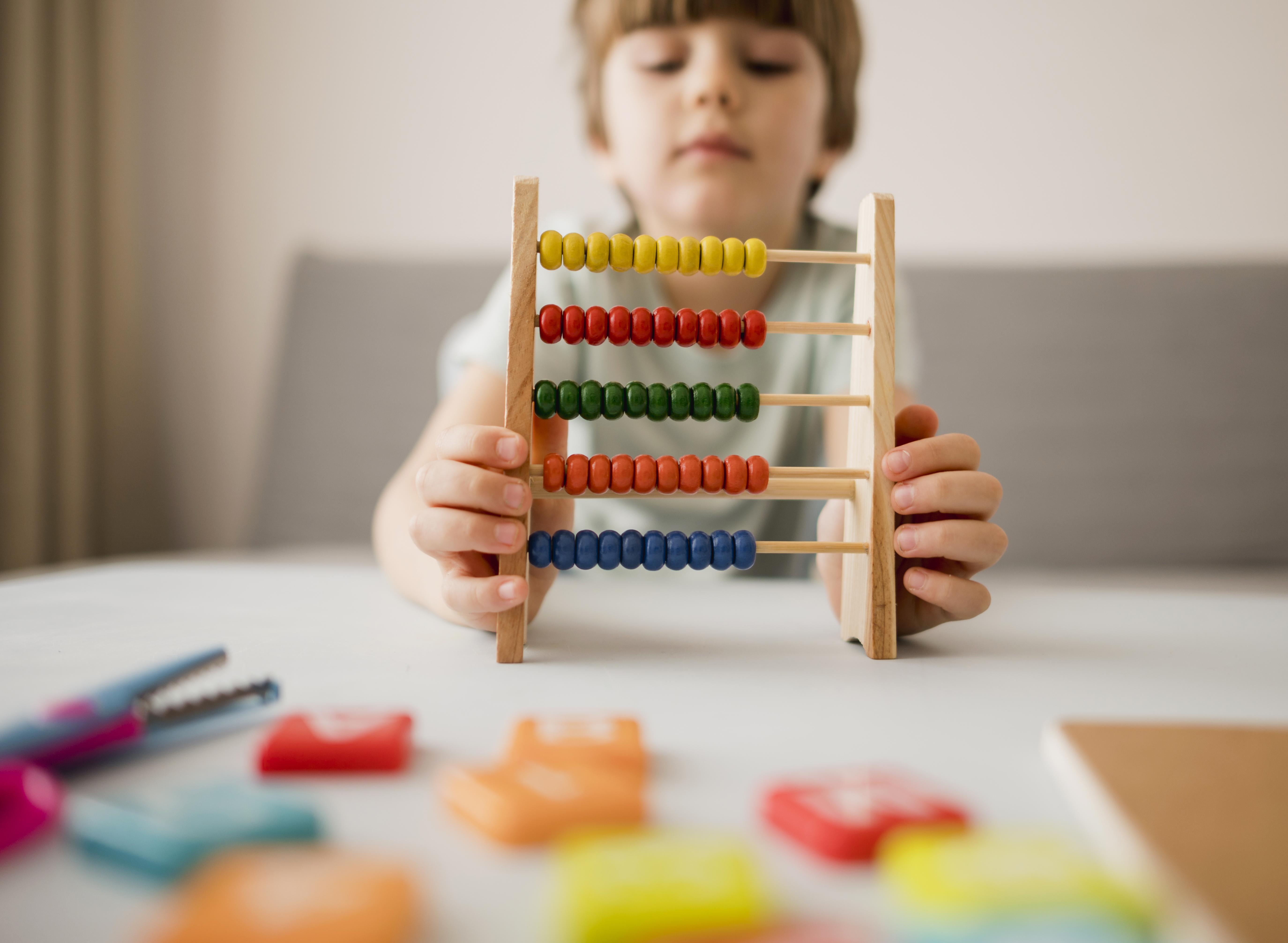 Child using abacus for early math learning