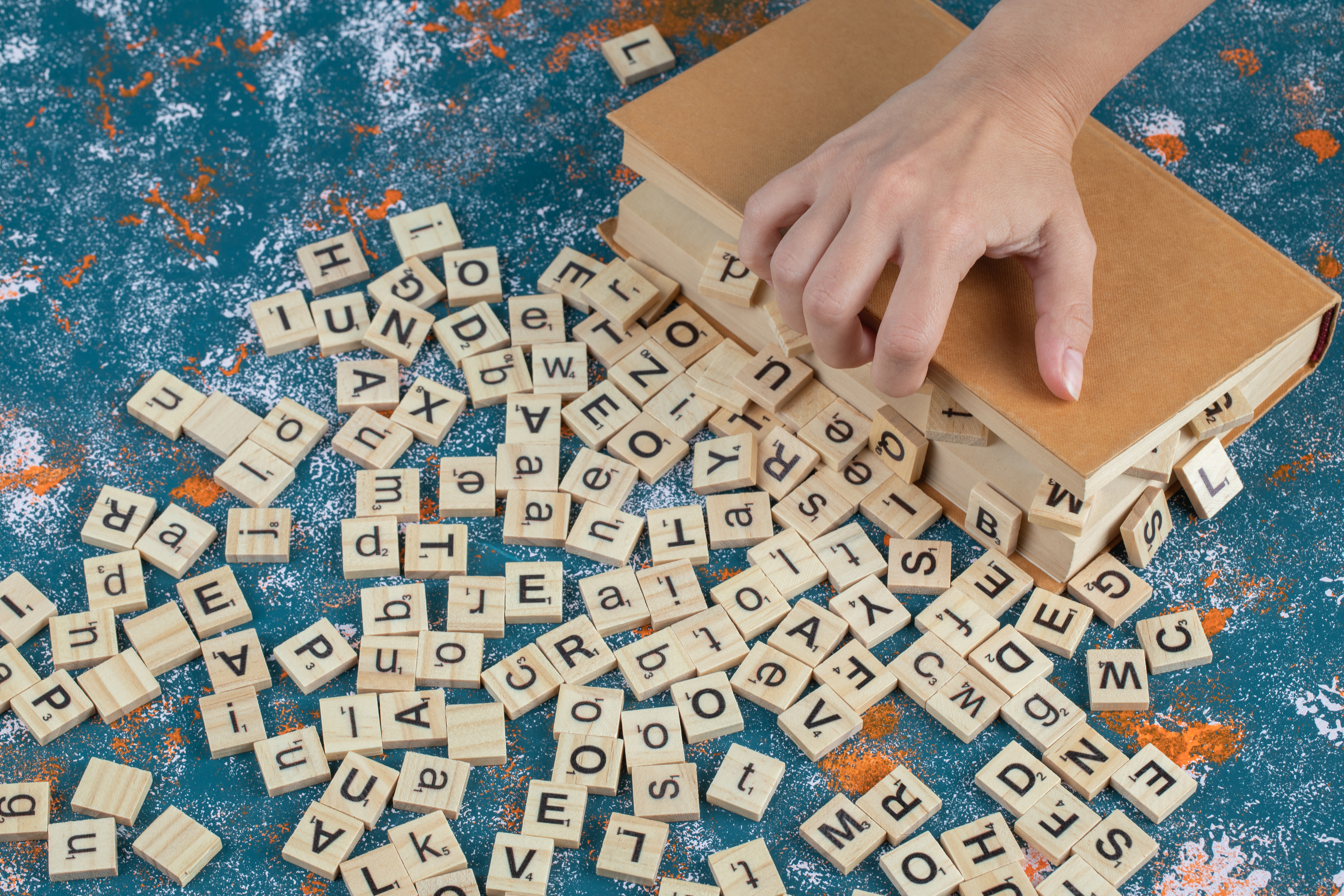 a box containing English letters with happy kids around and on the box, with a signal board written ‘English’