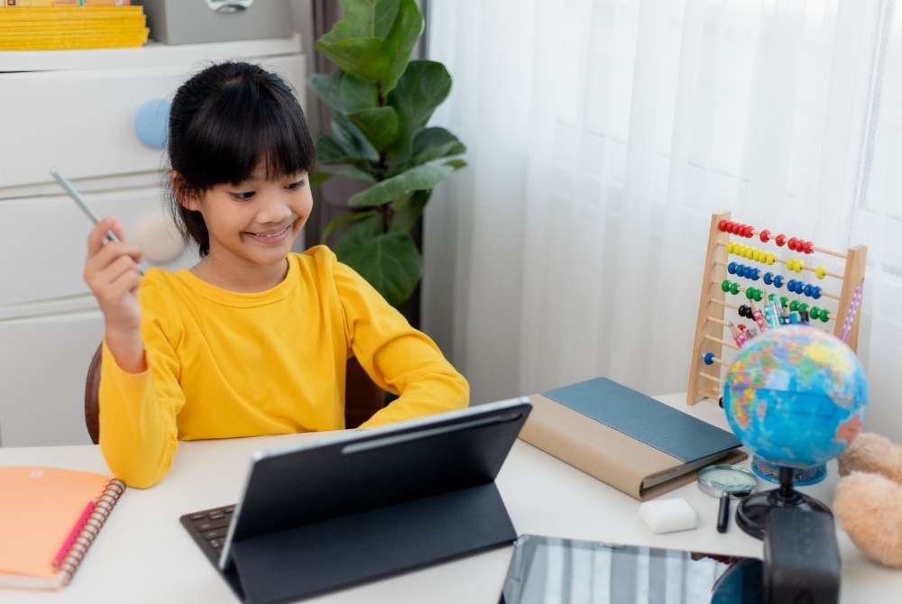 A child doing abacus on a tab in abacusmasterclass live