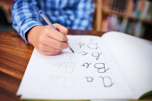 boy writing spelling